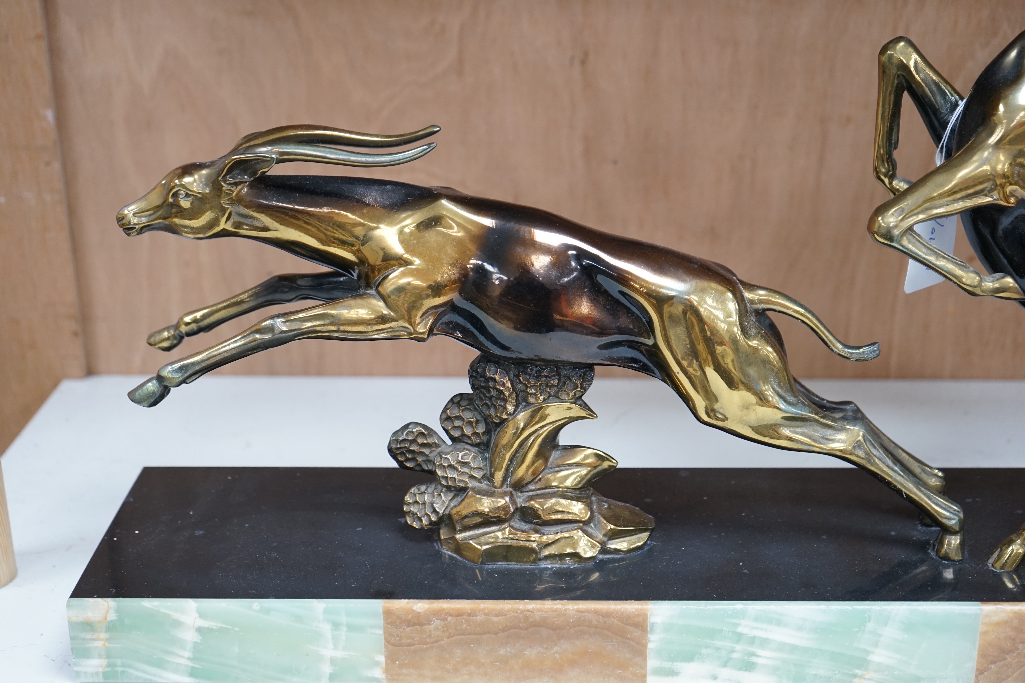 An Art Deco antelope group on marble base, signed, Limousin, 70cm